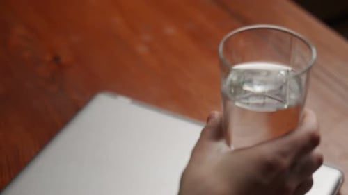 Taking Pill with Water Close Up