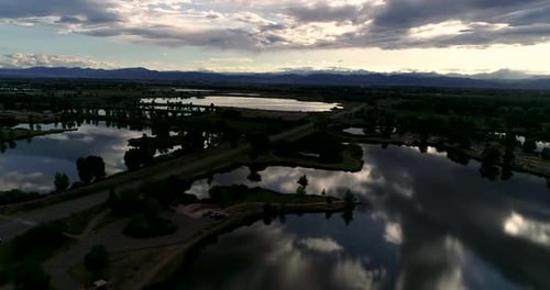 Be humbled in awe at this sunset taken by drone of the Rocky Mountains with reflections in the lakes