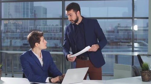 Business Discussion in a Modern Office Setting