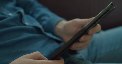Hands of Young Man Using TabletPC at Home Office. Communication, Online Shopping, Chat, Social