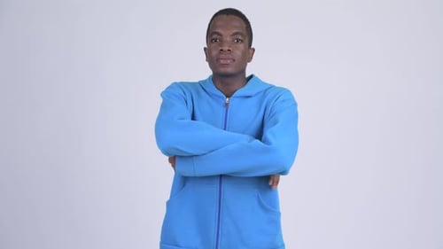 Young Adult in Blue Hoodie Arms Crossed Portrait