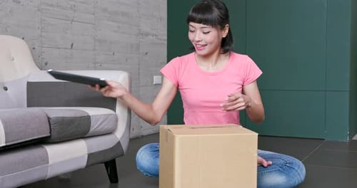 Woman Happily Opens Box, Shops Online