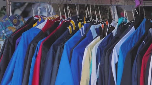 BARCELONA SPAIN JANUARY 5 2020 Vintage Second Hand Hat and Clothes Rail Showing Colourful Vintage