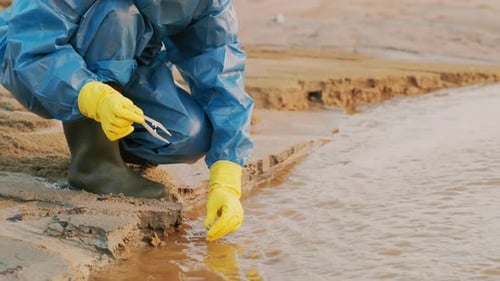 Scientist Examining Water Sample for Pollution