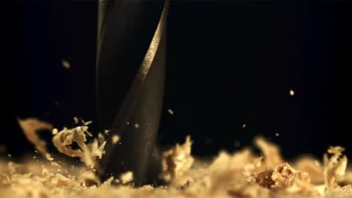 Drill Bit Boring into Wood in Close Up