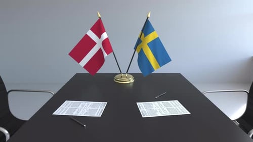 Denmark and Sweden Flags on Conference Table for International Agreement