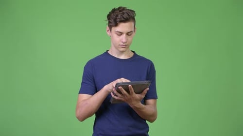 Teen Using Tablet Device in Studio Setting