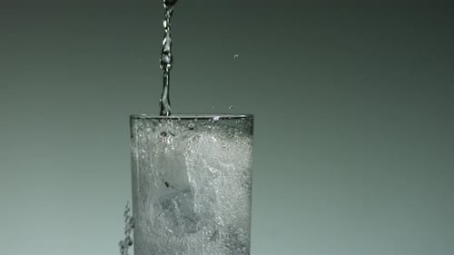 Refreshing Drink Being Poured Over Ice