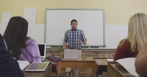 Teacher talking at his high school class