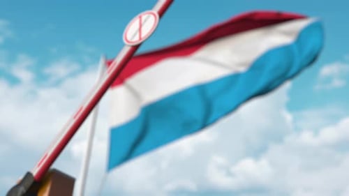 Luxembourg Travel Restriction Barrier with Coronavirus Sign