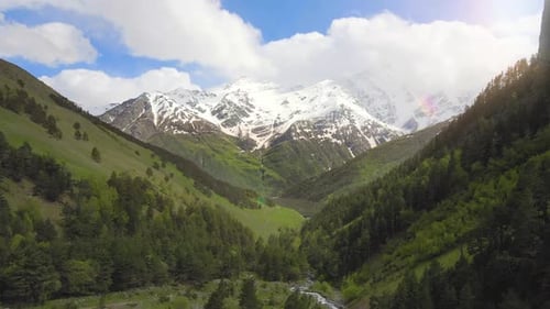 Aerial Flying Between Mountains in the Mountain Canyon