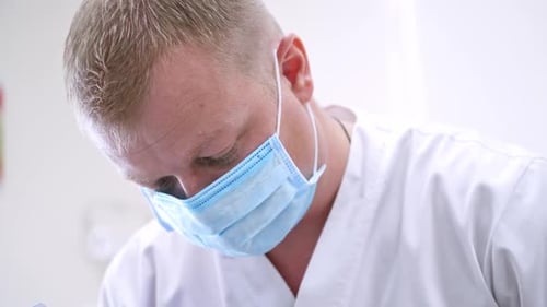 Doctor treats patient teeth in modern dental clinic. Health teeth concept.