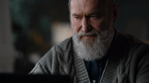 Happy Old Business Man Working Laptop Computer at Home Office