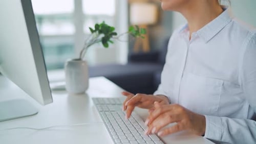 Woman Working at Computer in Home Office
