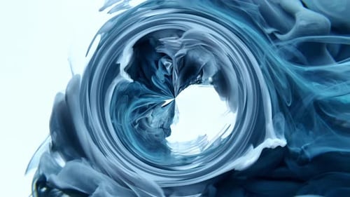 Swirling Cyan and White Ink Vortex