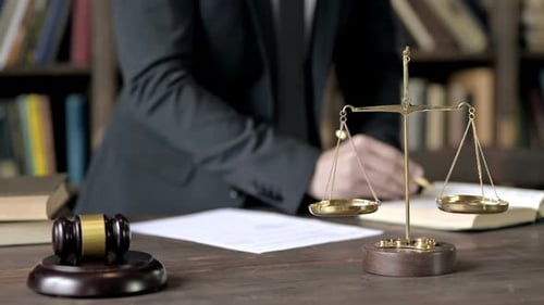 Close Up Shoot of Judge Hand Checking Document in Court Room