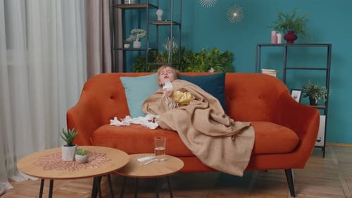 Sick Child Resting on Couch at Home