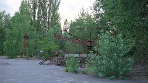 Abandoned Dilapidated Ride in Overgrown Amusement Park