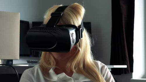 Woman Uses Virtual Reality Headset in Modern Home