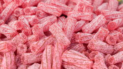 Pile of Red Licorice Candy Coated with Sugar