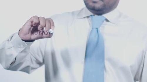 Man Writes Monday on Clear Surface