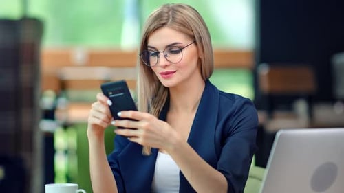 Business Woman Working With Laptop and Smartphone