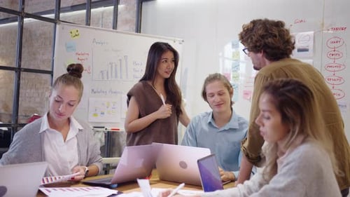 Marketing Team Collaborates on Strategy in Modern Office