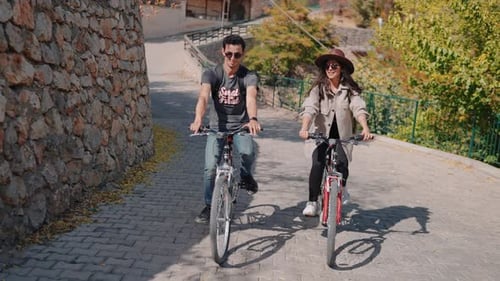 Happy Couple Riding Bikes