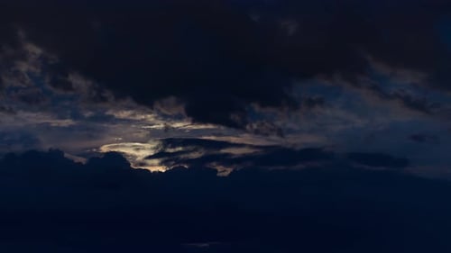 Dark Cloudy Sky and the Sun Coming Through