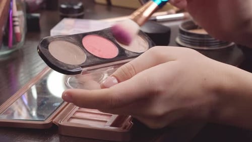 Female Hands Applying Makeup Blush From Face Cosmetic Palette Close Up
