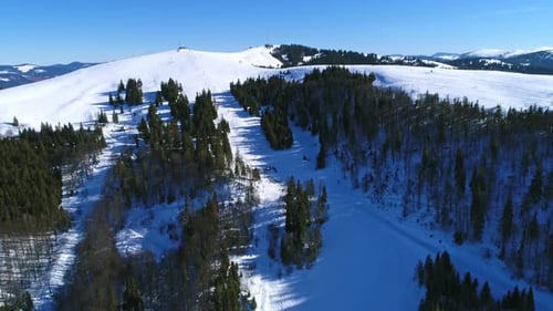 Aerial - Ski Lift at Ski Resort in Sunny Carpatian Mountains