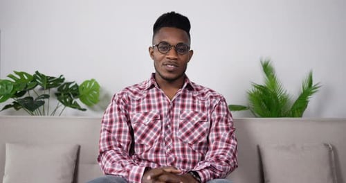 Young Adult Talking on Video Chat at Home