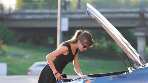 Helpless Woman Standing Near Her Car with Open Hood Takling on Mobile Phone Calling Road Service for
