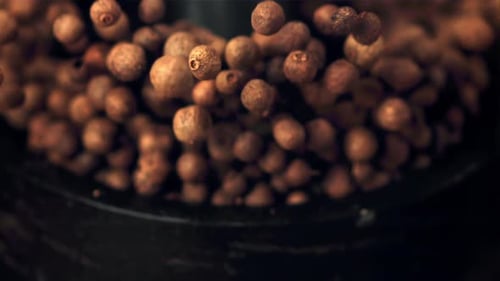 Pile of Whole Peppercorns Filling a Metal Bowl
