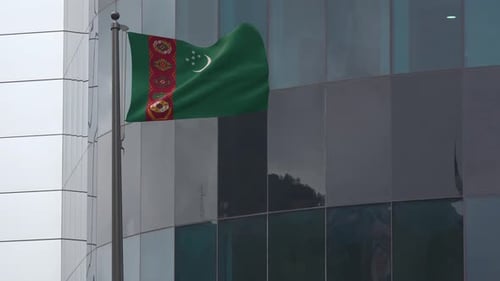 Waving Turkmenistan Flag on a Modern Building Pole