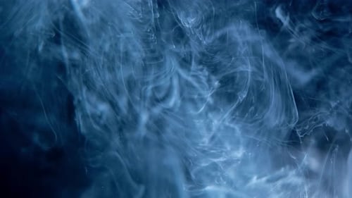 Smoke Abstract. Cloud. Black Background in Blue Light. Smoke Effect.