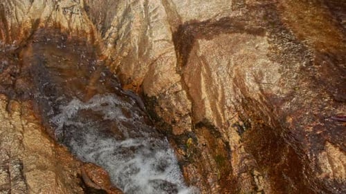 Foamy Mountain Stream Cascade Washes Brown Rocks