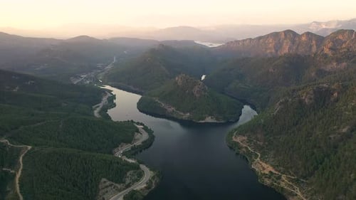 Sunset Over the River in the Mountains Filmed on a Drone