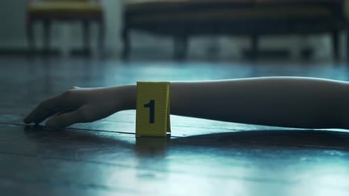 Static Arm with Evidence Marker on Wooden Floor
