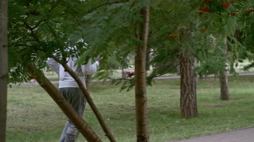 Athletic Man Jogging in Park