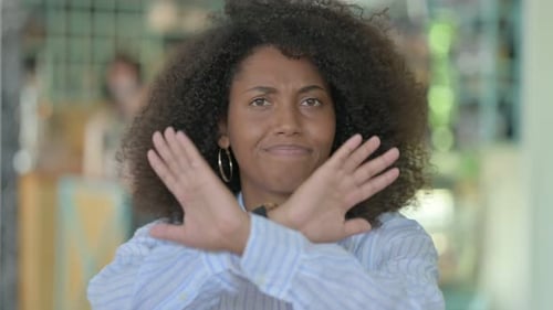 Angry African Woman Saying No By Arms Crossed