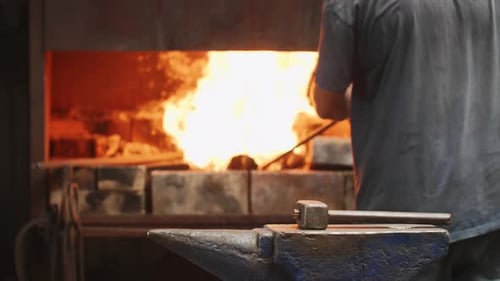 Blacksmith Working with Glowing Hot Metal