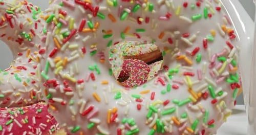 Delicious Frosted Donuts with Colorful Sprinkles