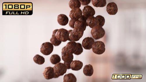 Chocolate Cereal Balls Falling in Slow Motion