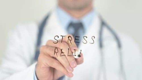 Doctor Writing Stress Relief on Glass