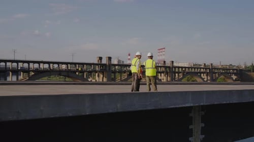 Contractors Talking on Unfinished Bridge