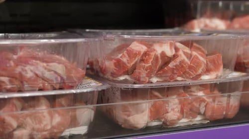 Close Up of Selection of Raw Pre Packed Red Meat Displayed in Supermarket