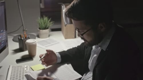 Man Analyzing Financial Data