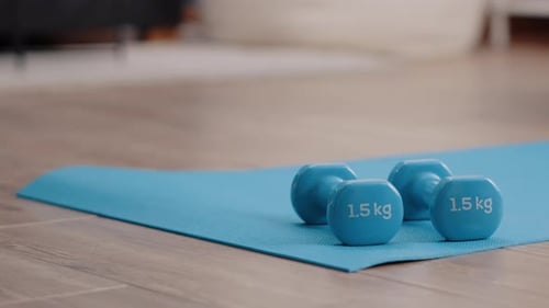 Close Up of Dumbbells Used to Train Arms Muscles at Home