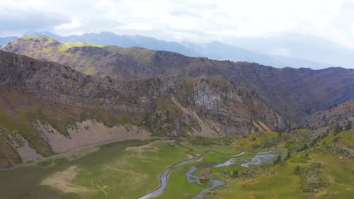 Panorama of Mountains and Winding River. Aerial View .